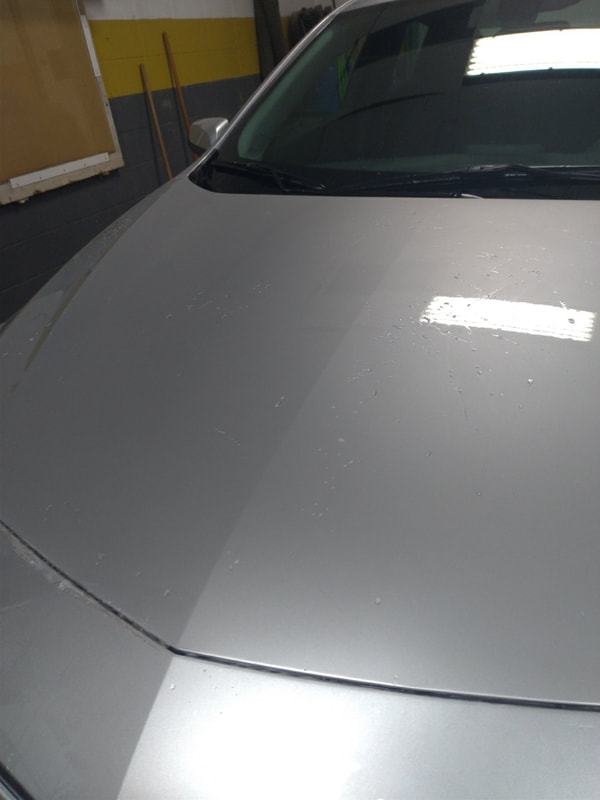 Paint protection film on hood of Chevy Malibu finished