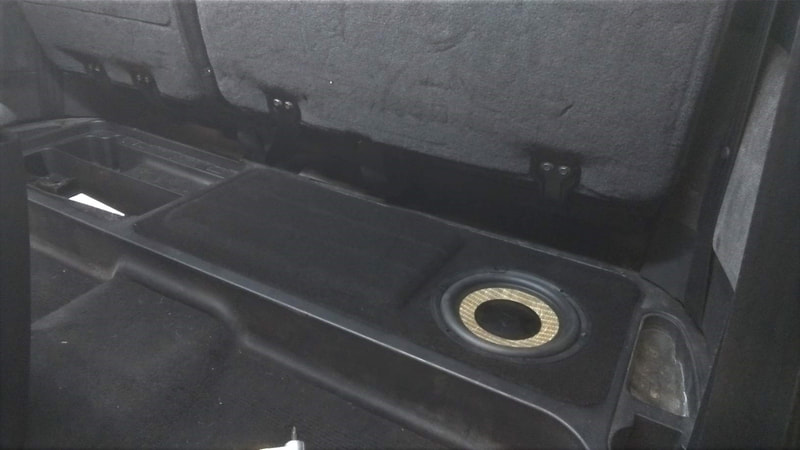Under seat car audio system with Focal speakers